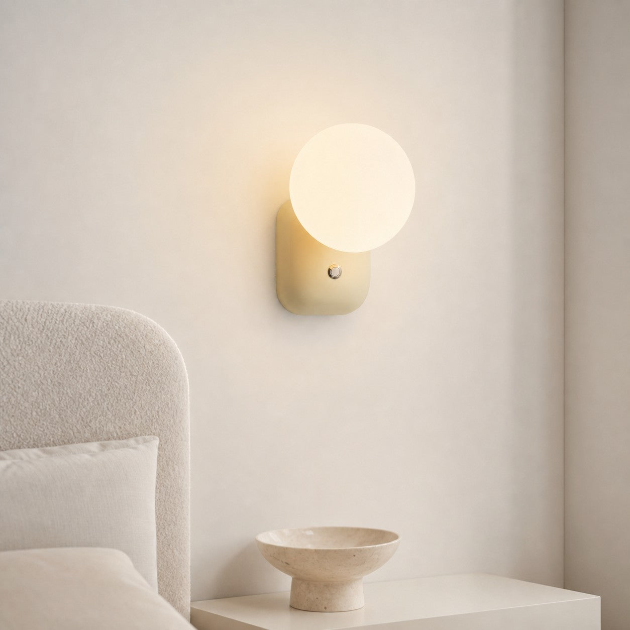 Luma Cream White wall sconce in a calm bedroom