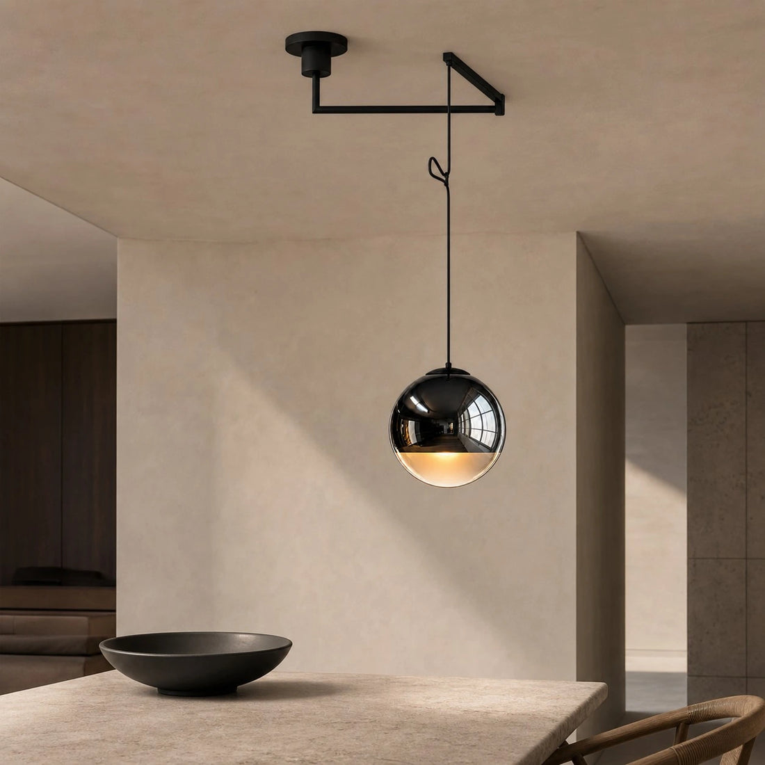 Style B swing-arm Luma pendant above a kitchen island