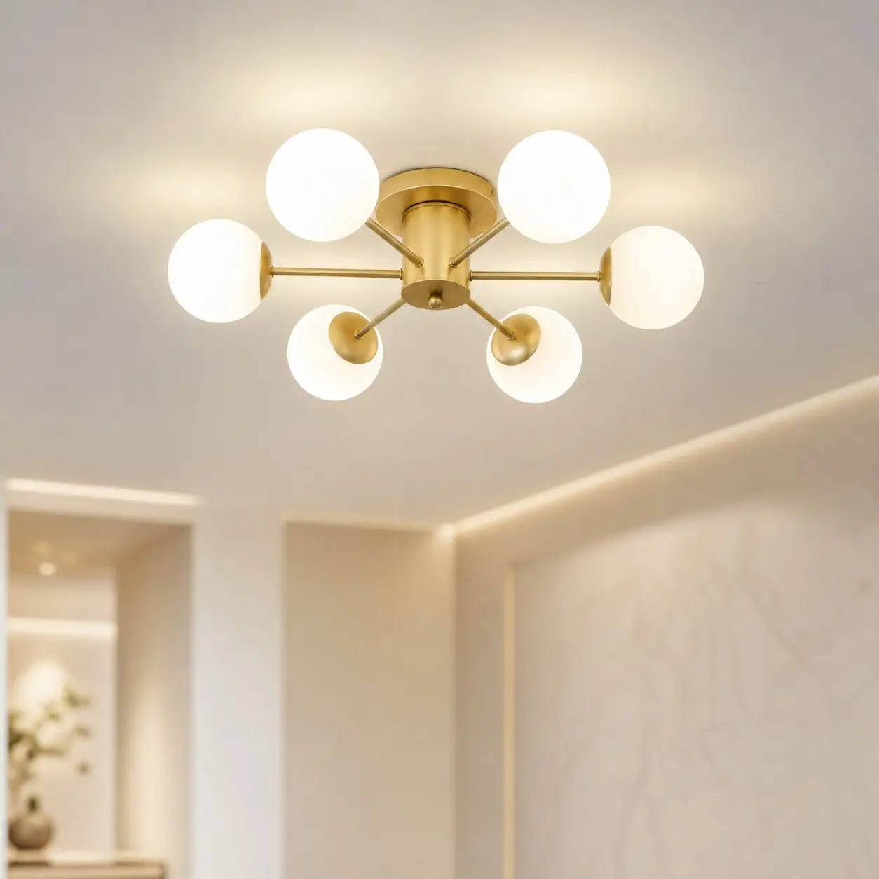 Six-head gold globe ceiling light in a bright modern interior