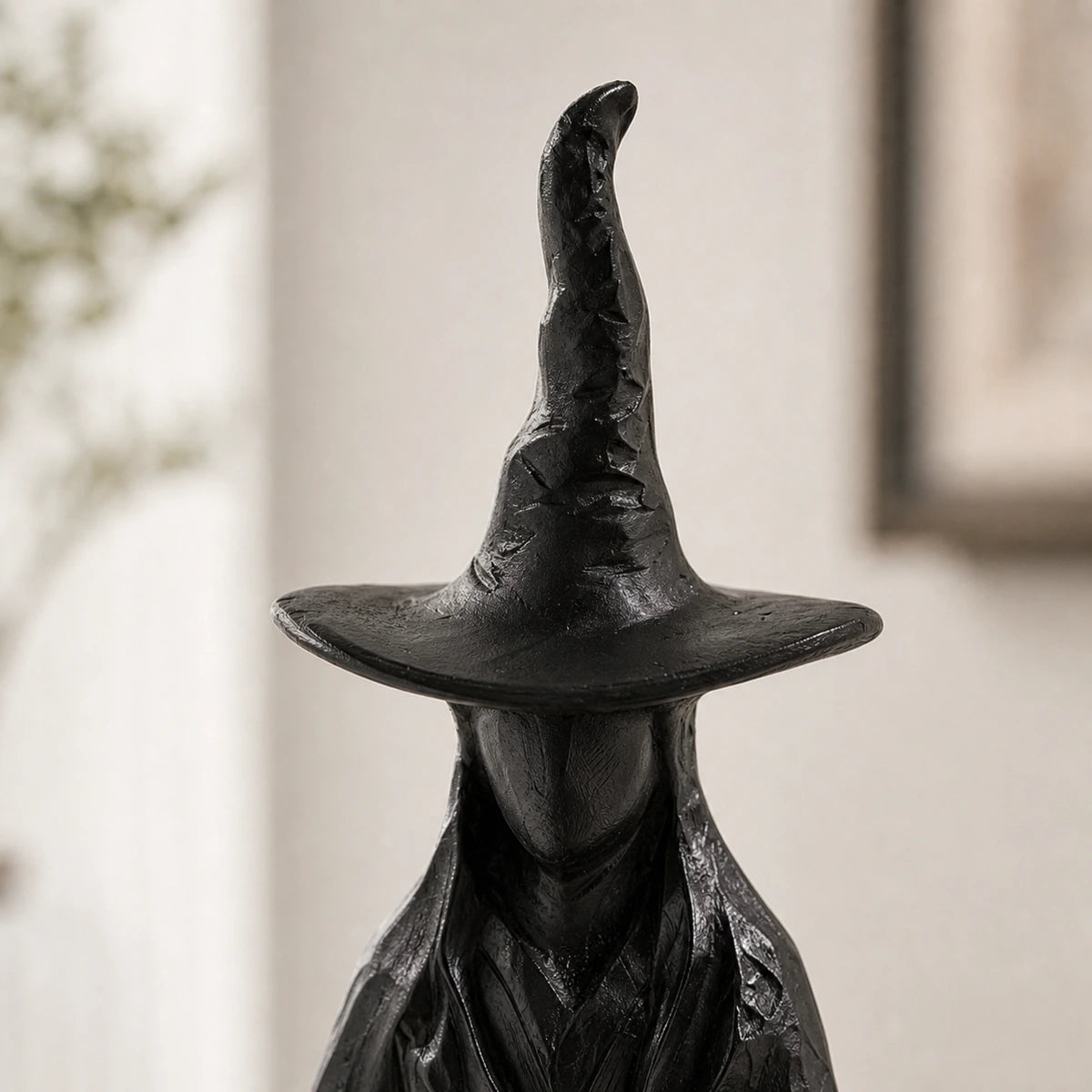 Aura candlestick pointed hat detail