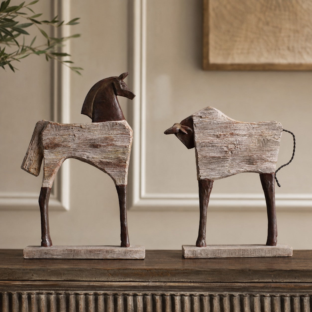 Equora horse and bull sculptures in a light interior