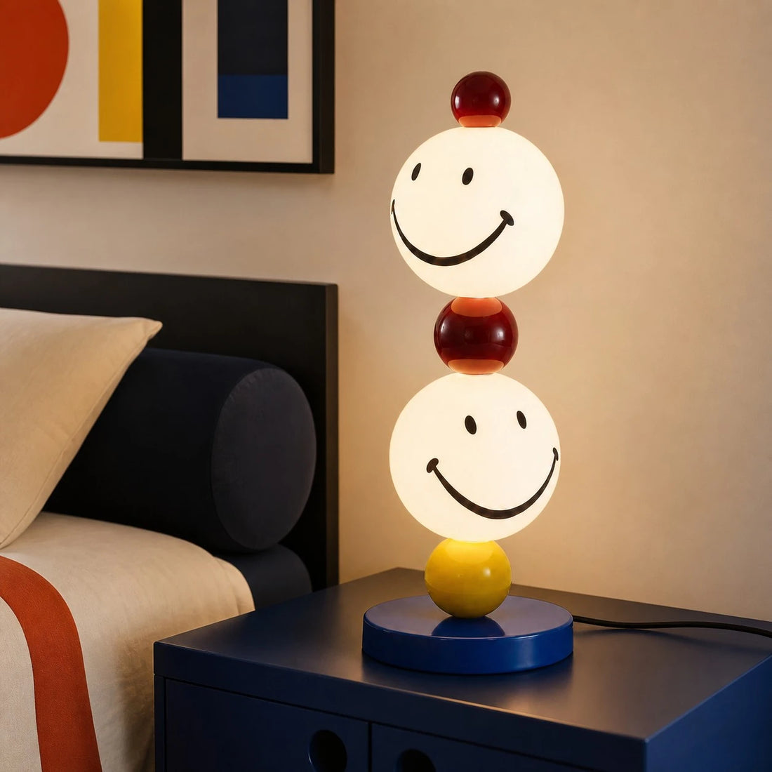 Smiley stack table lamp in a warm bedside setting