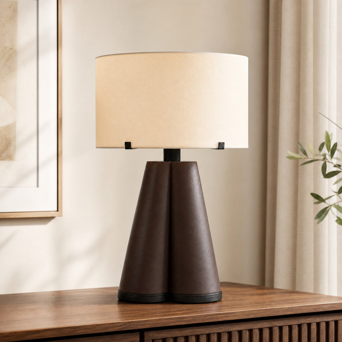 Brown leather table lamp on a wood console