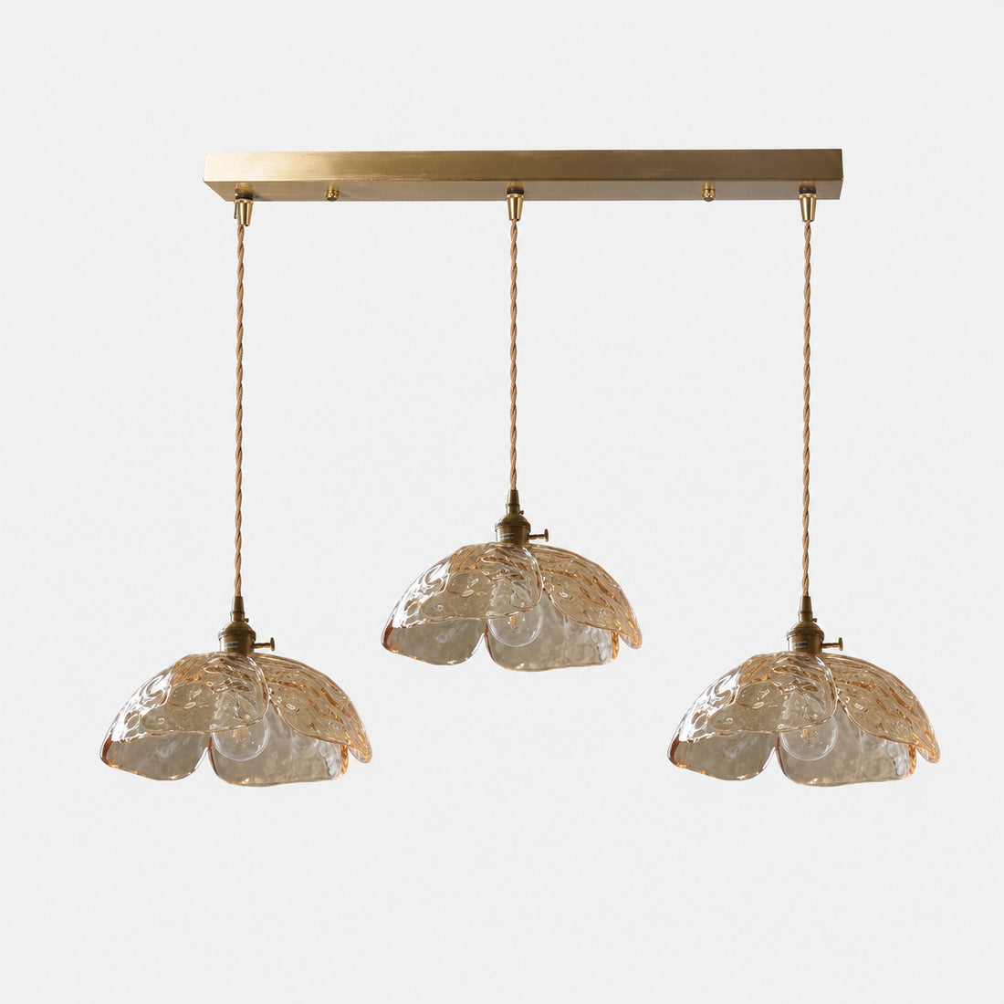 Three-light amber flower pendant with brass sockets