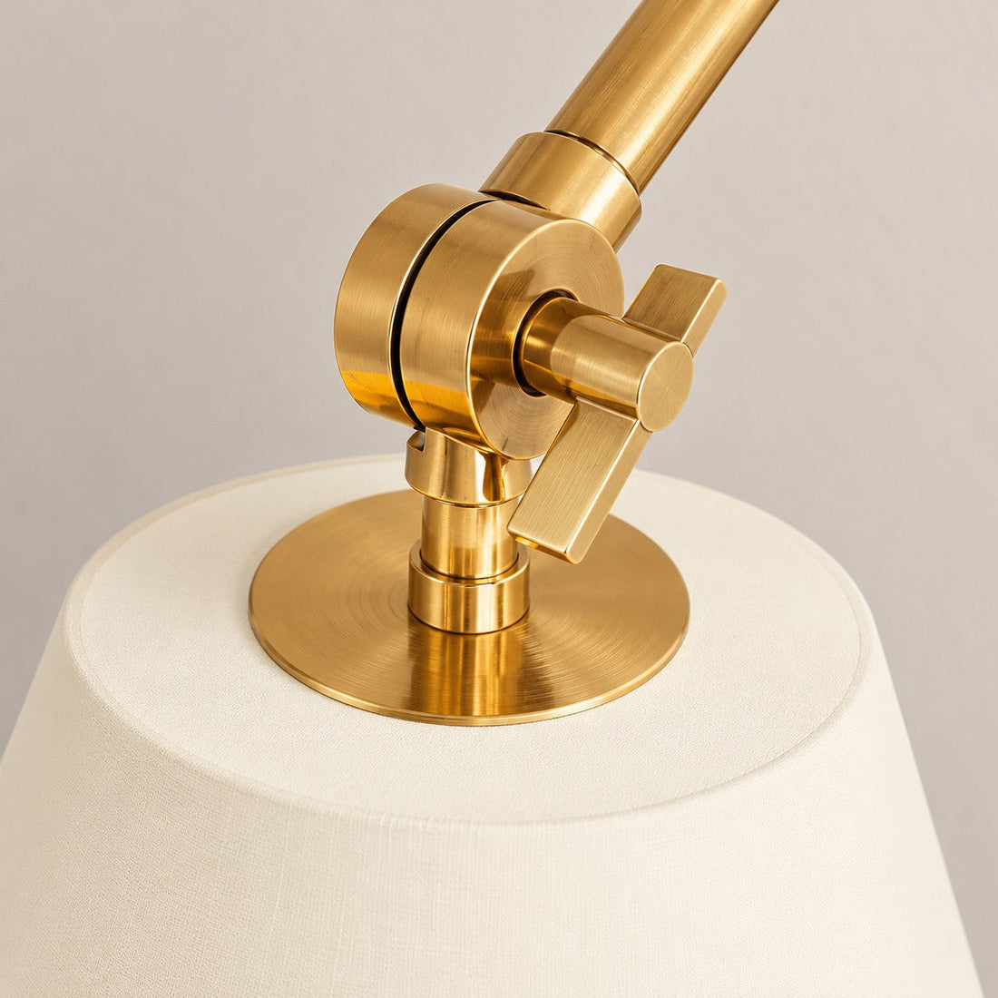 Close-up of the brass arm joint and shade fitting