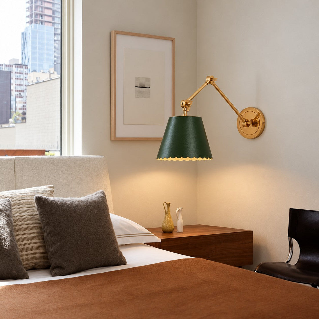 Green Foldray sconce styled beside a window and walnut nightstand