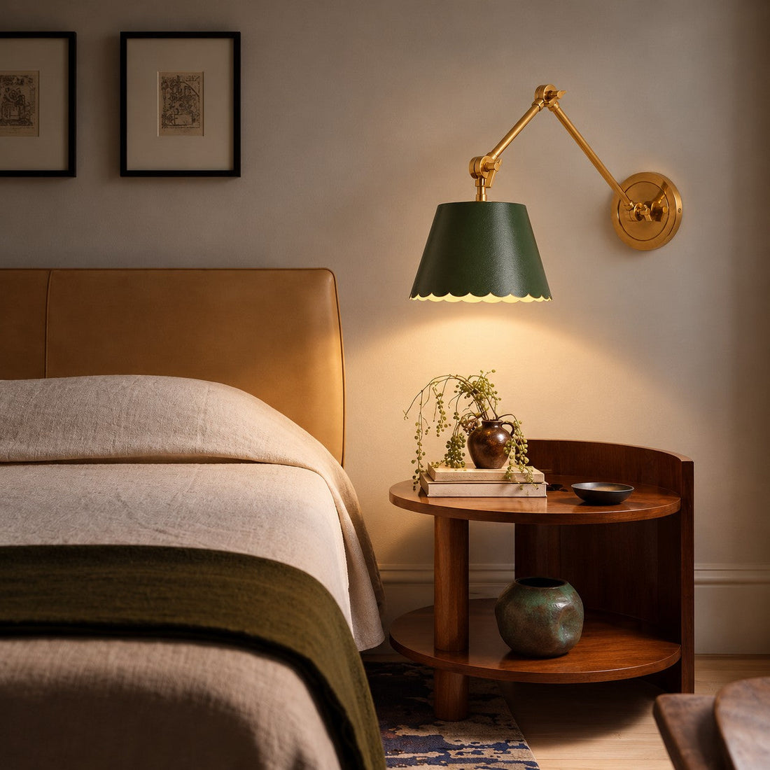 Green Foldray sconce styled beside a tan leather headboard