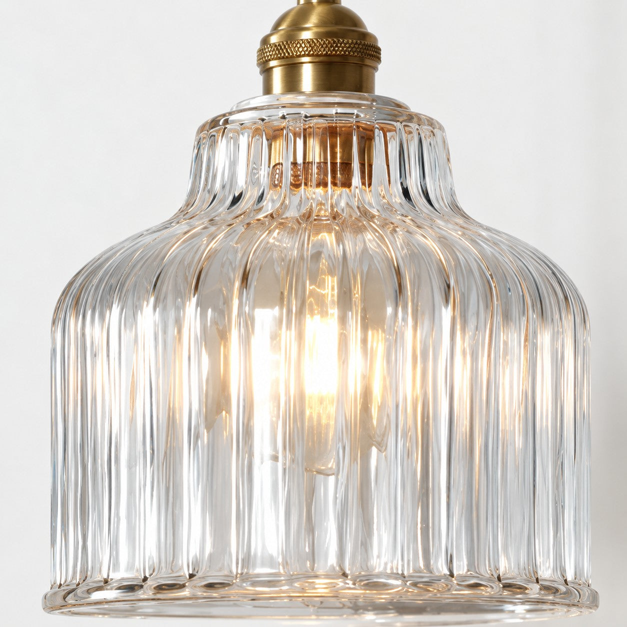 Gildon ribbed glass pendant, illuminated front view