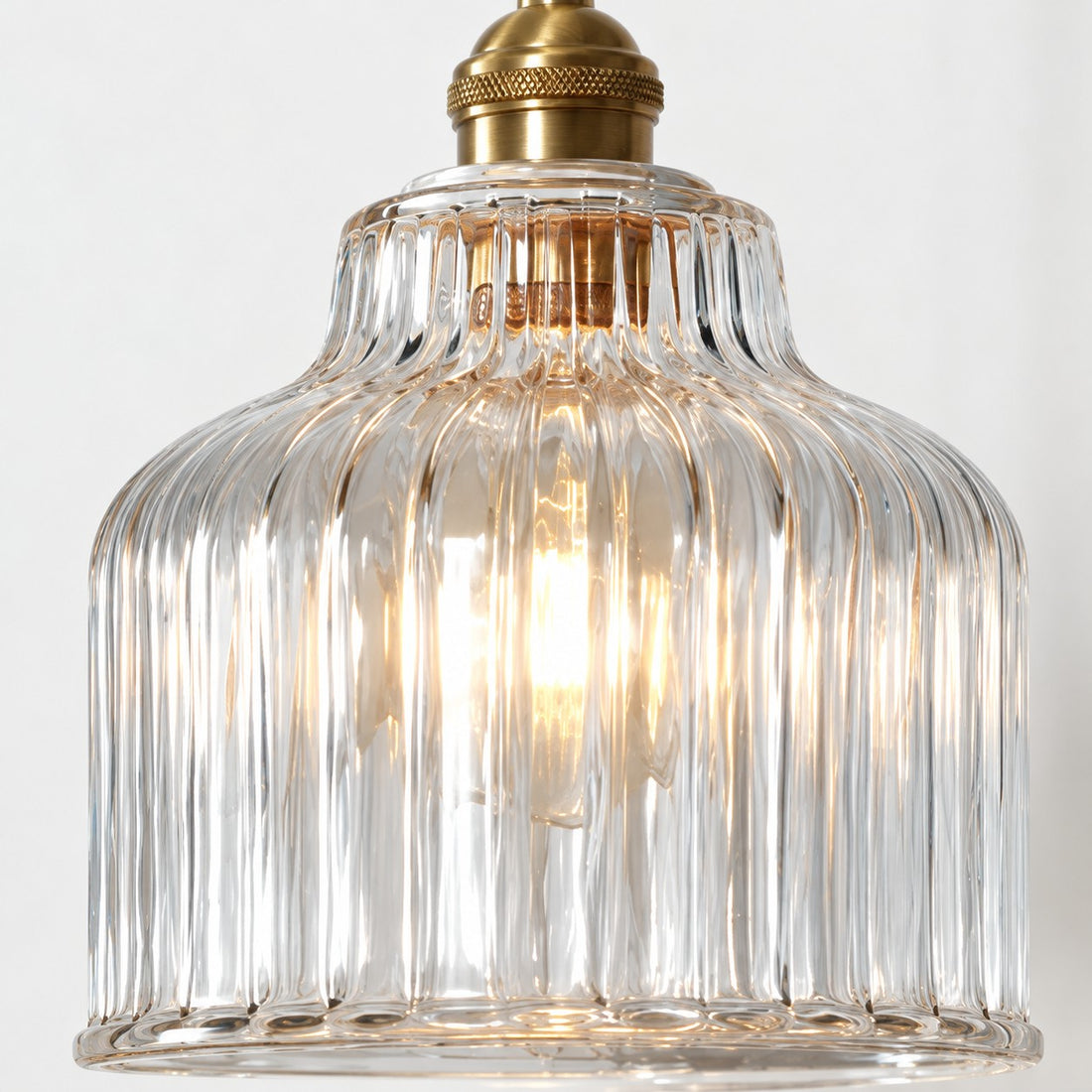 Gildon ribbed glass pendant, illuminated front view