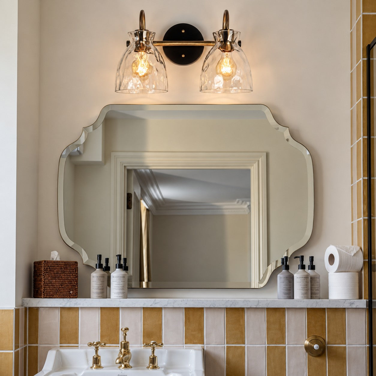 Gildon two-head ripple glass wall sconce in a tiled bathroom