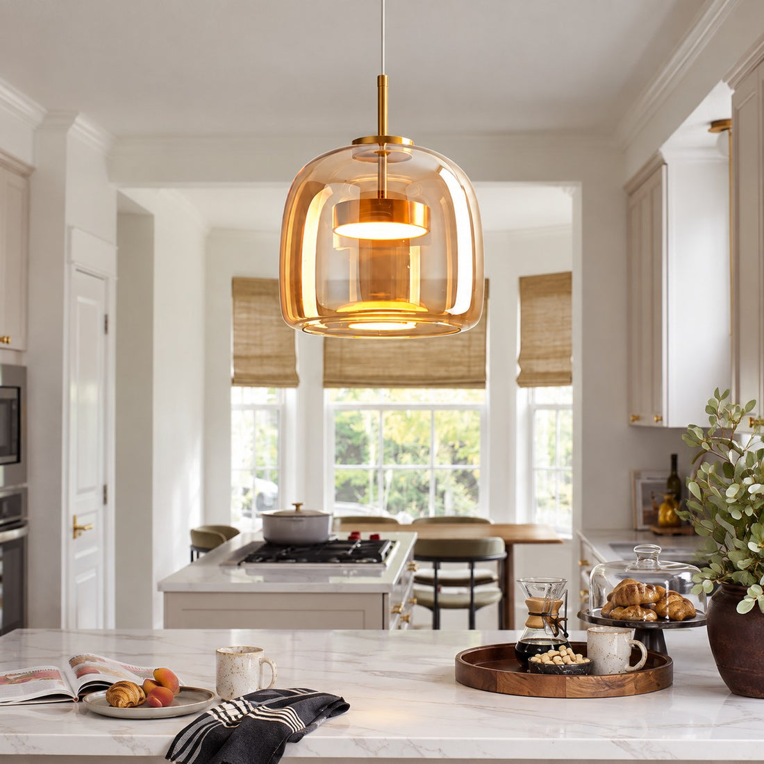 Iridora smoke grey pendant over a dining table
