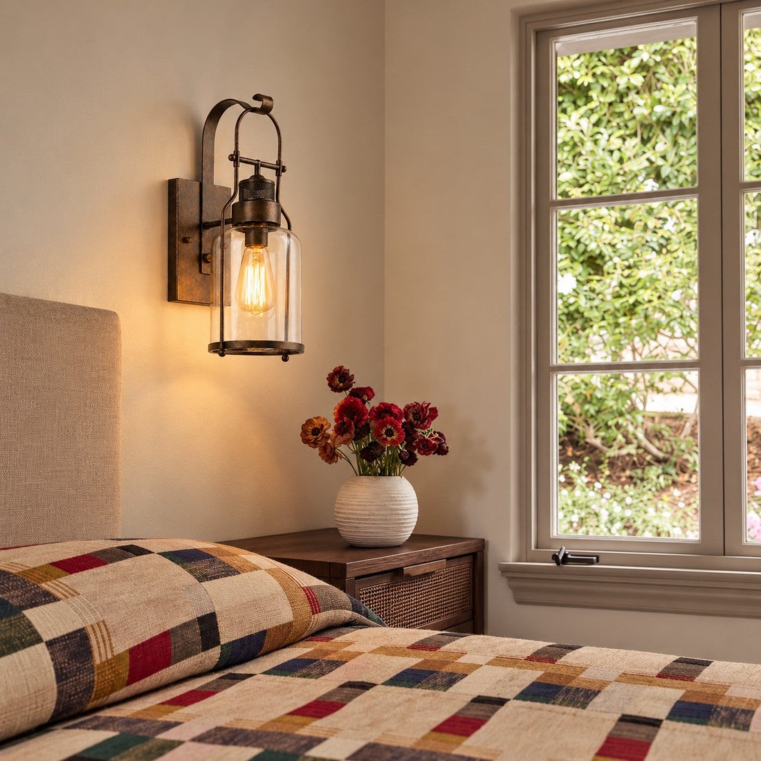 Wall sconce styled beside a bedroom window