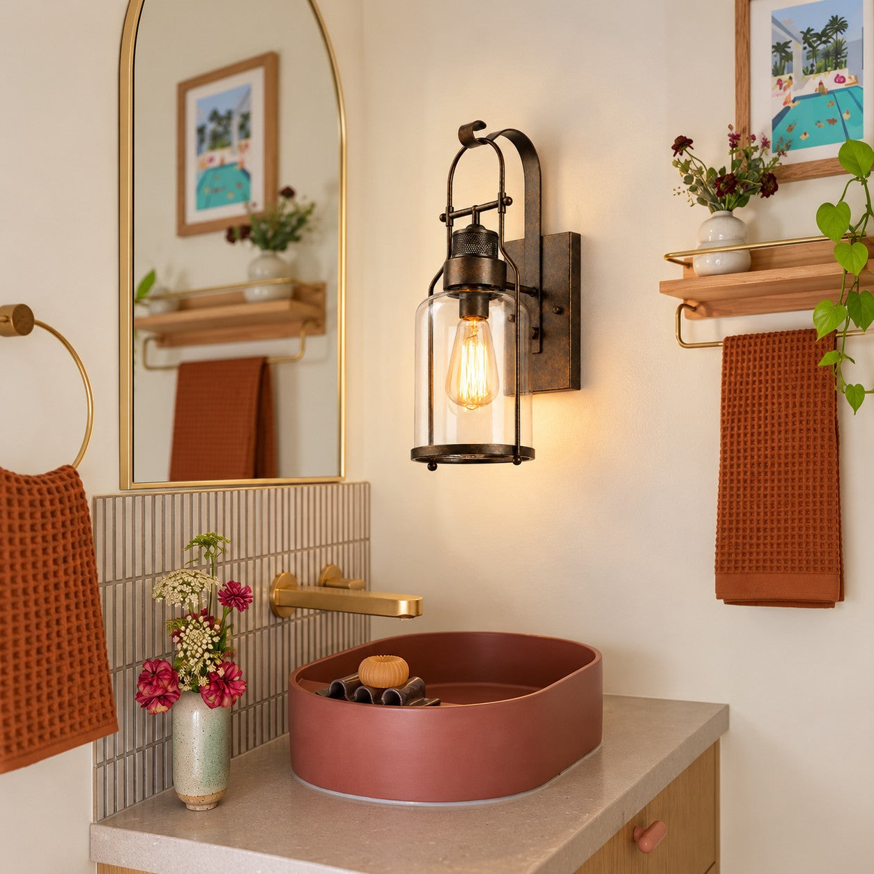 Wall sconce styled above a bathroom vanity