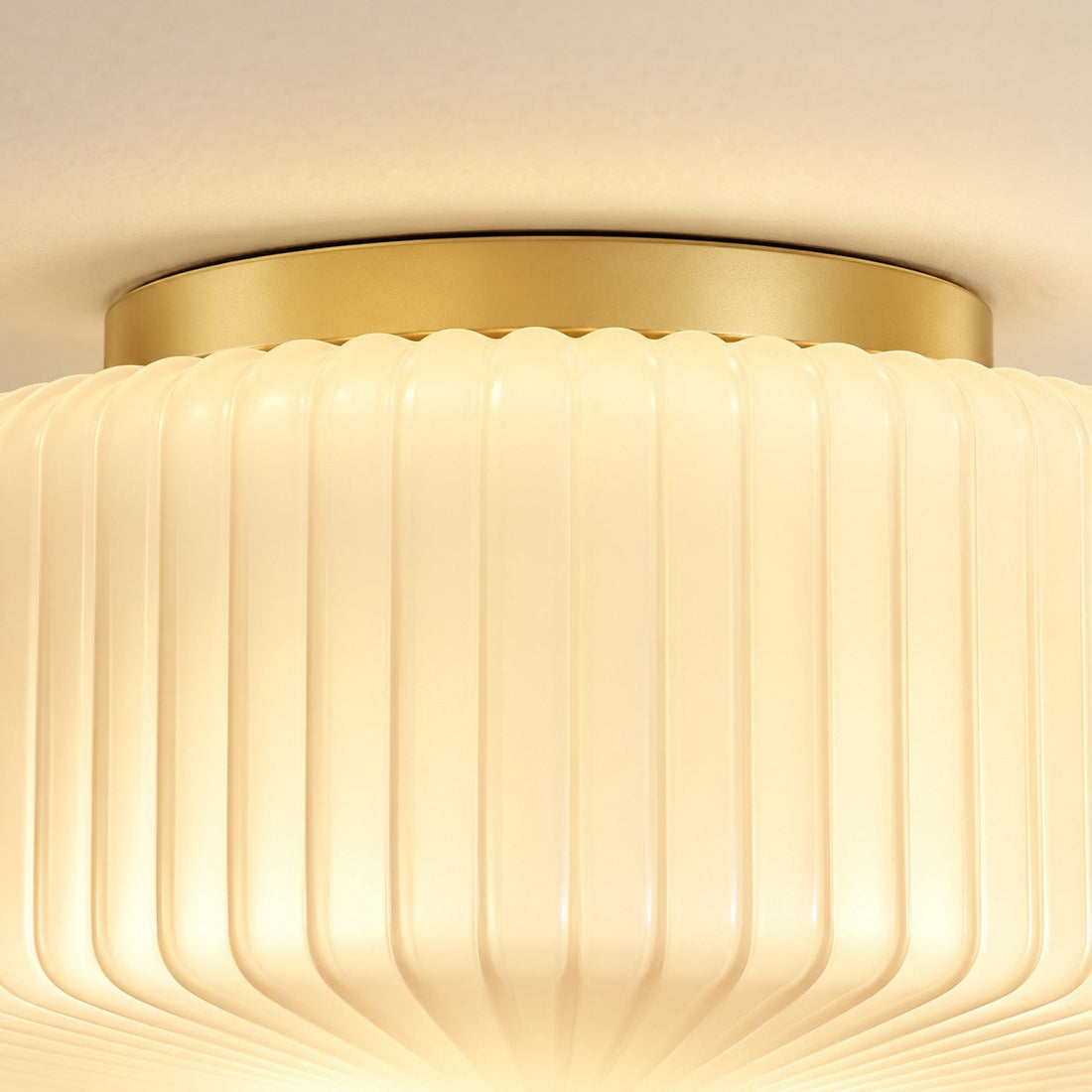 Close-up of the brass ring and vertical ribs on the opaline shade
