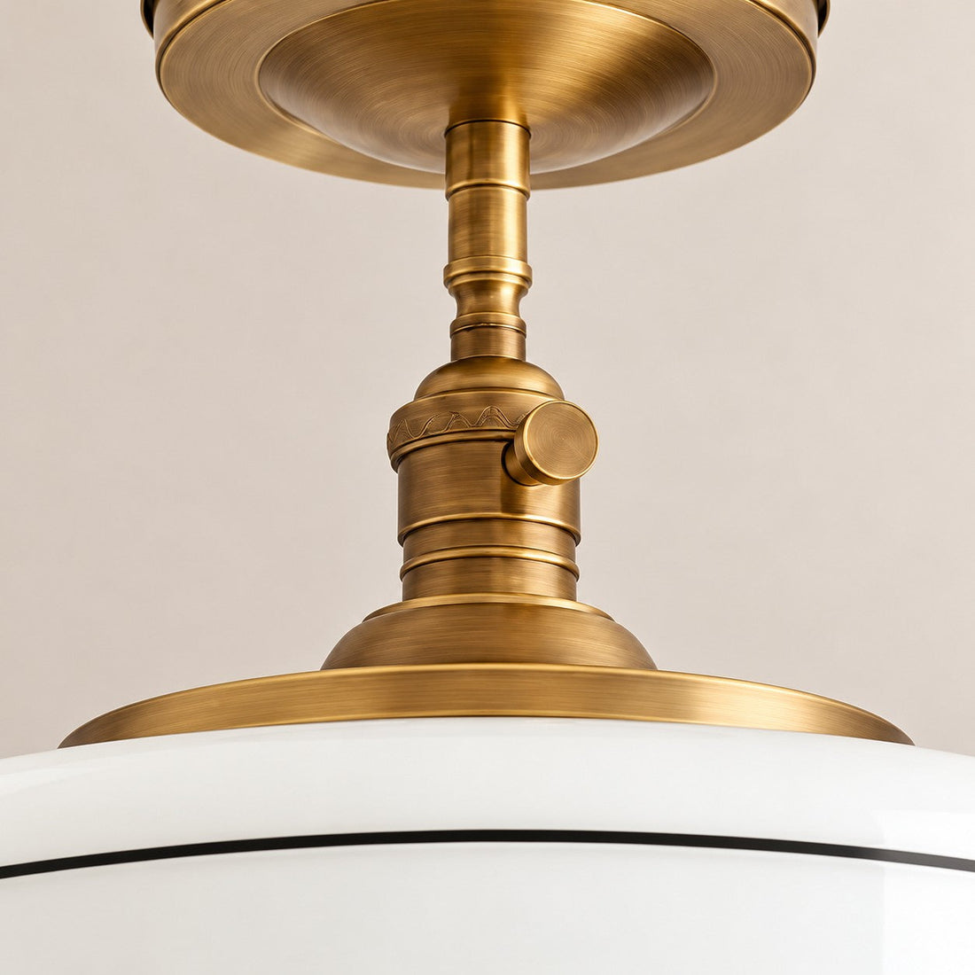 Close-up of the brass fitting where the stem meets the shade