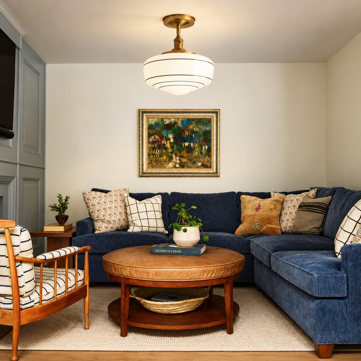 Ceiling lamp styled above a blue sectional sofa