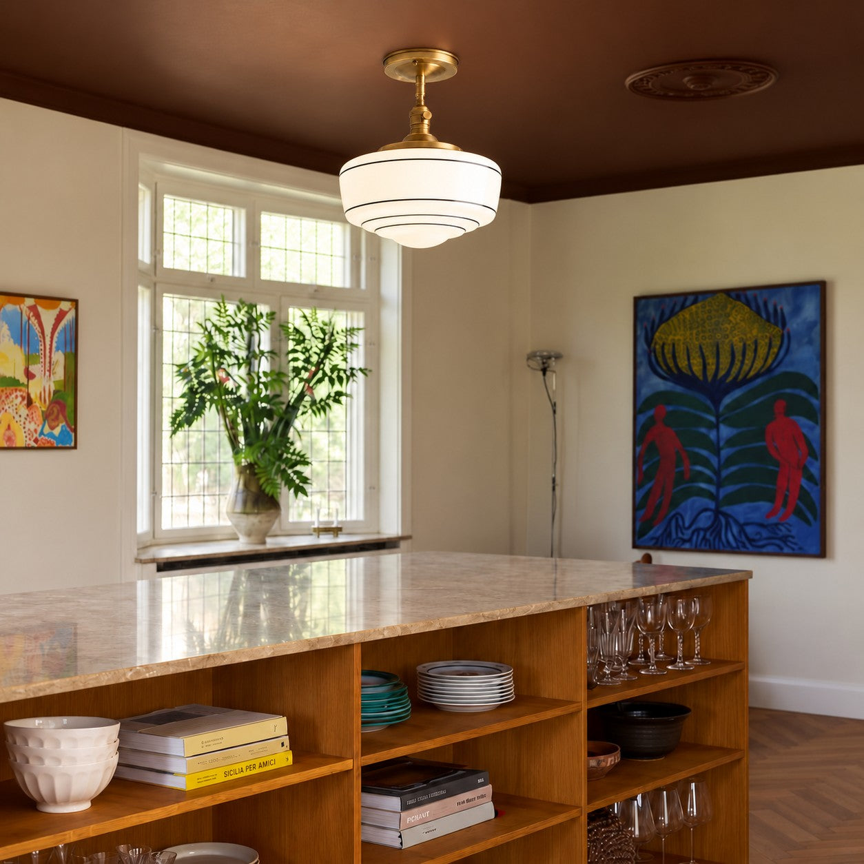 Ceiling lamp styled over a wood island in a kitchen