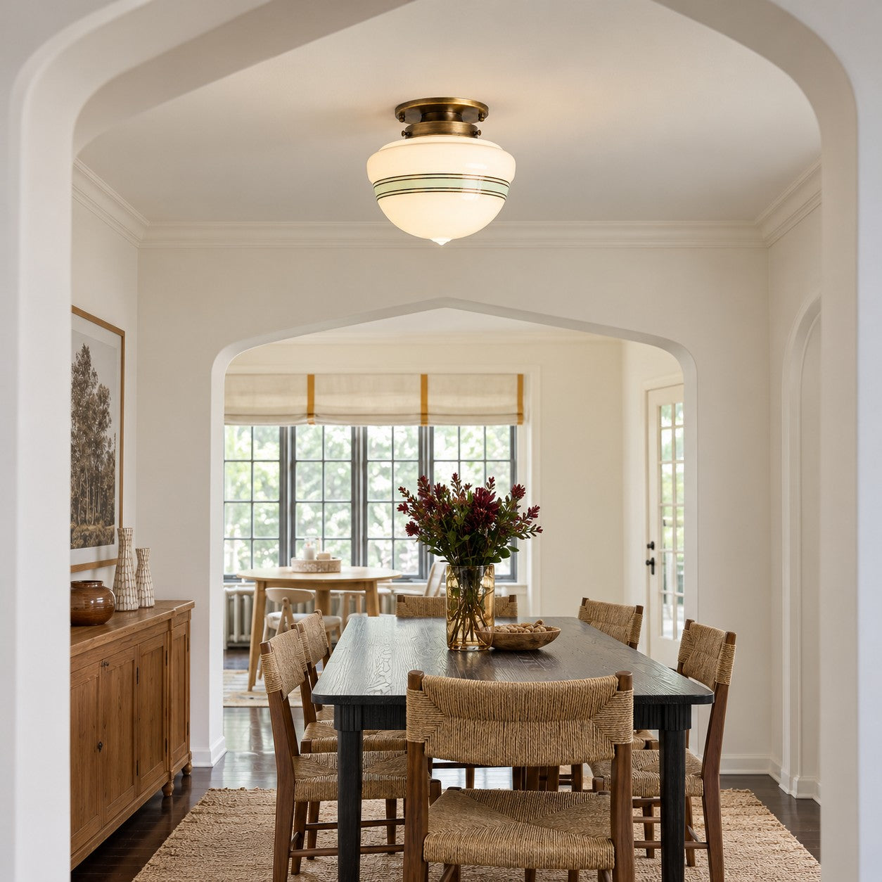 Opelina brass schoolhouse ceiling light styled over a dining table