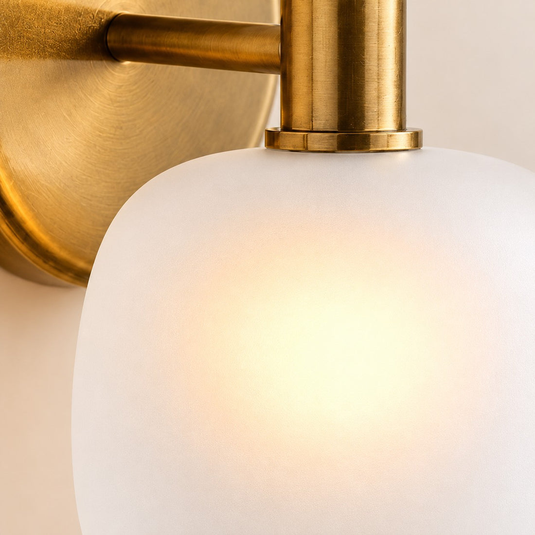 Opelina frosted glass shade and brass arm close-up