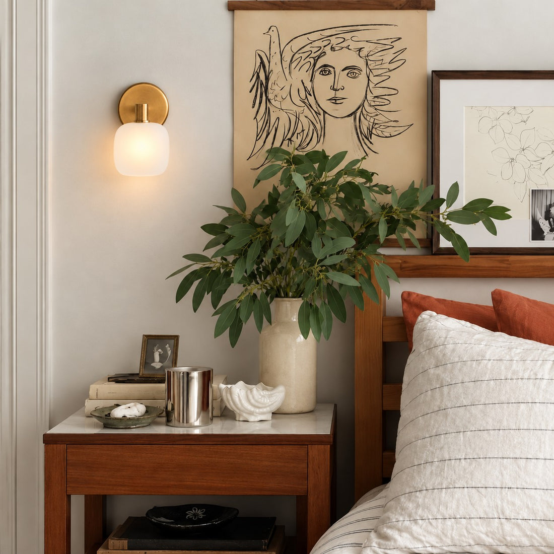Opelina frosted glass wall sconce styled on a marble bathroom vanity