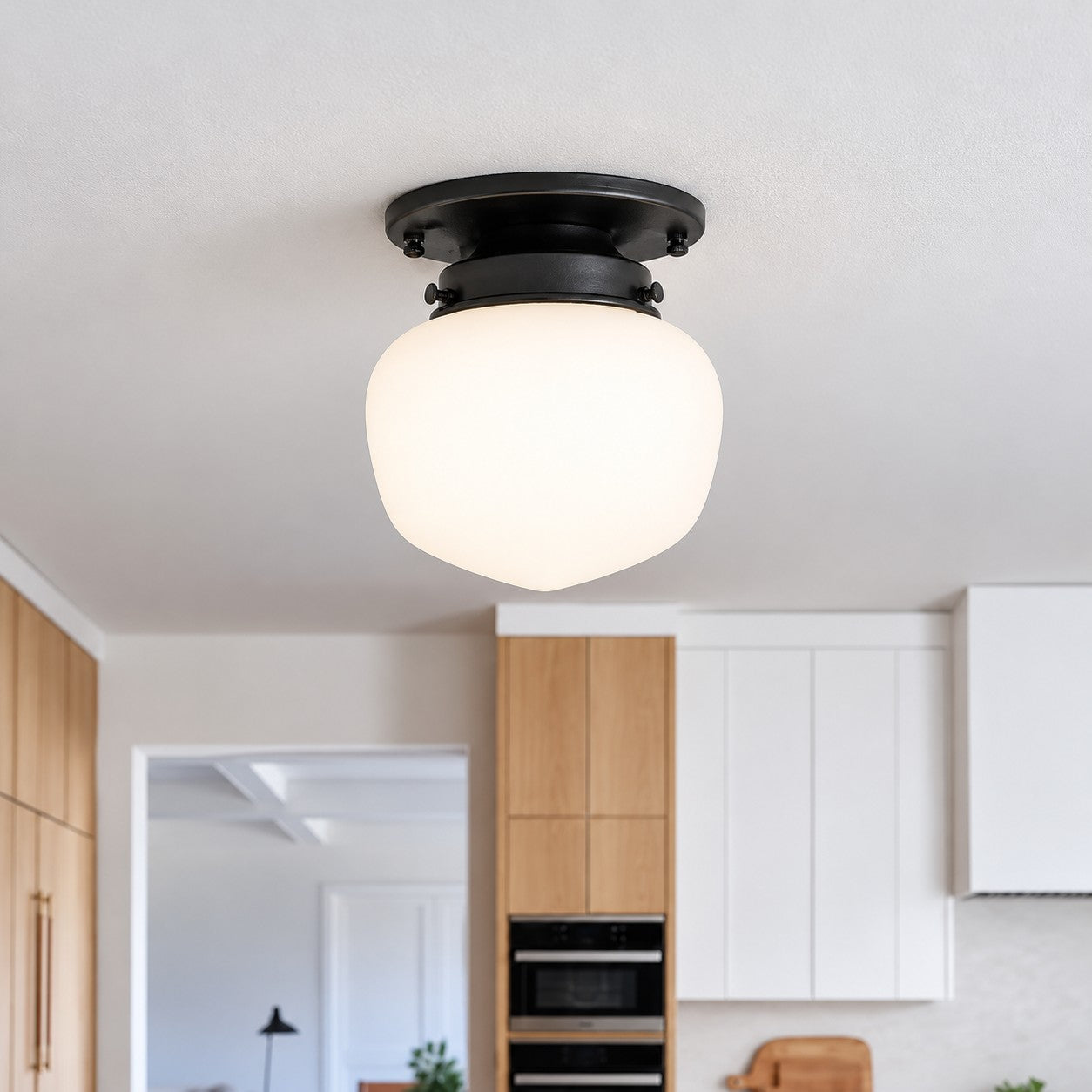 Opelina brass opal glass flush mount styled in a bedroom