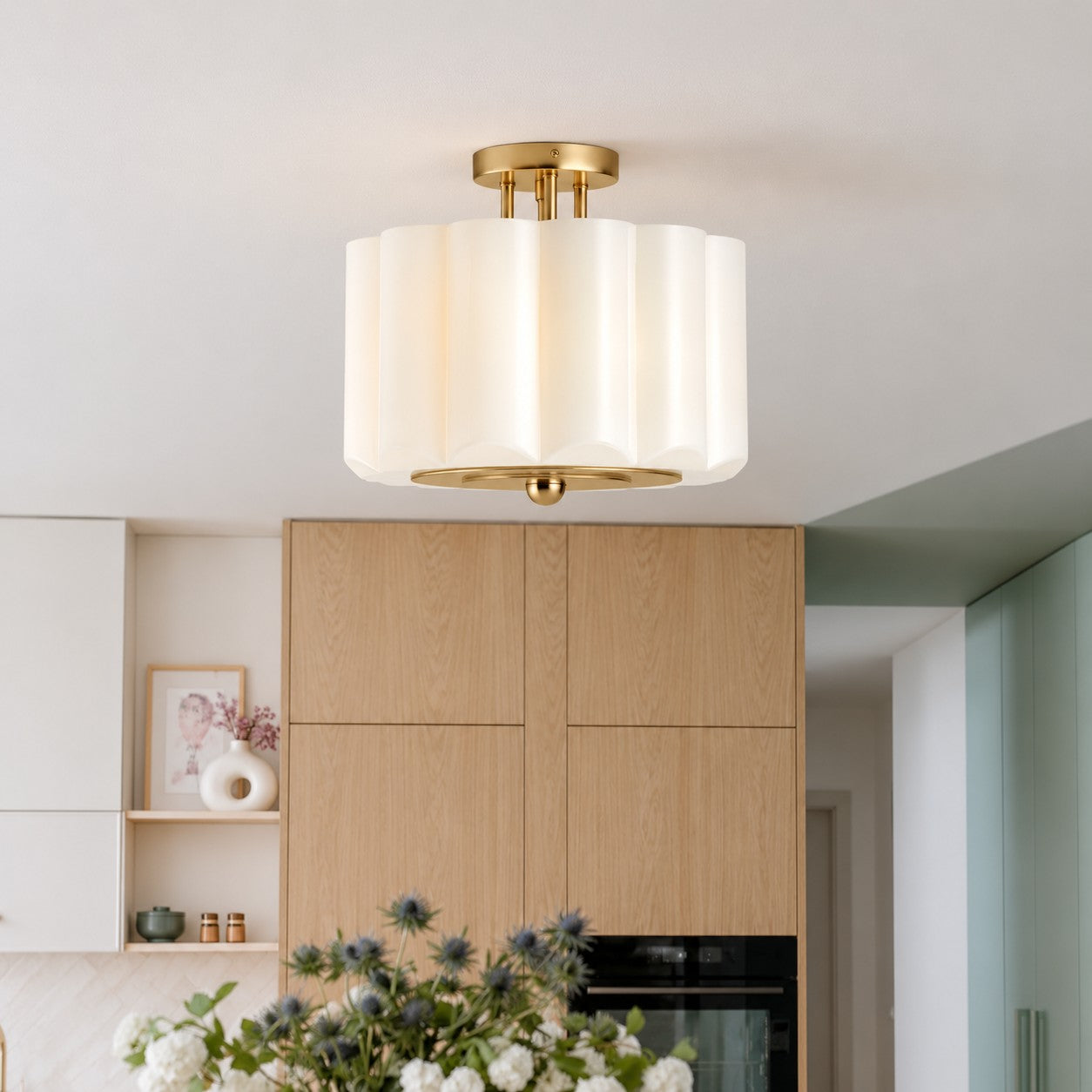 Opelina scalloped milk glass ceiling light over a living room sofa