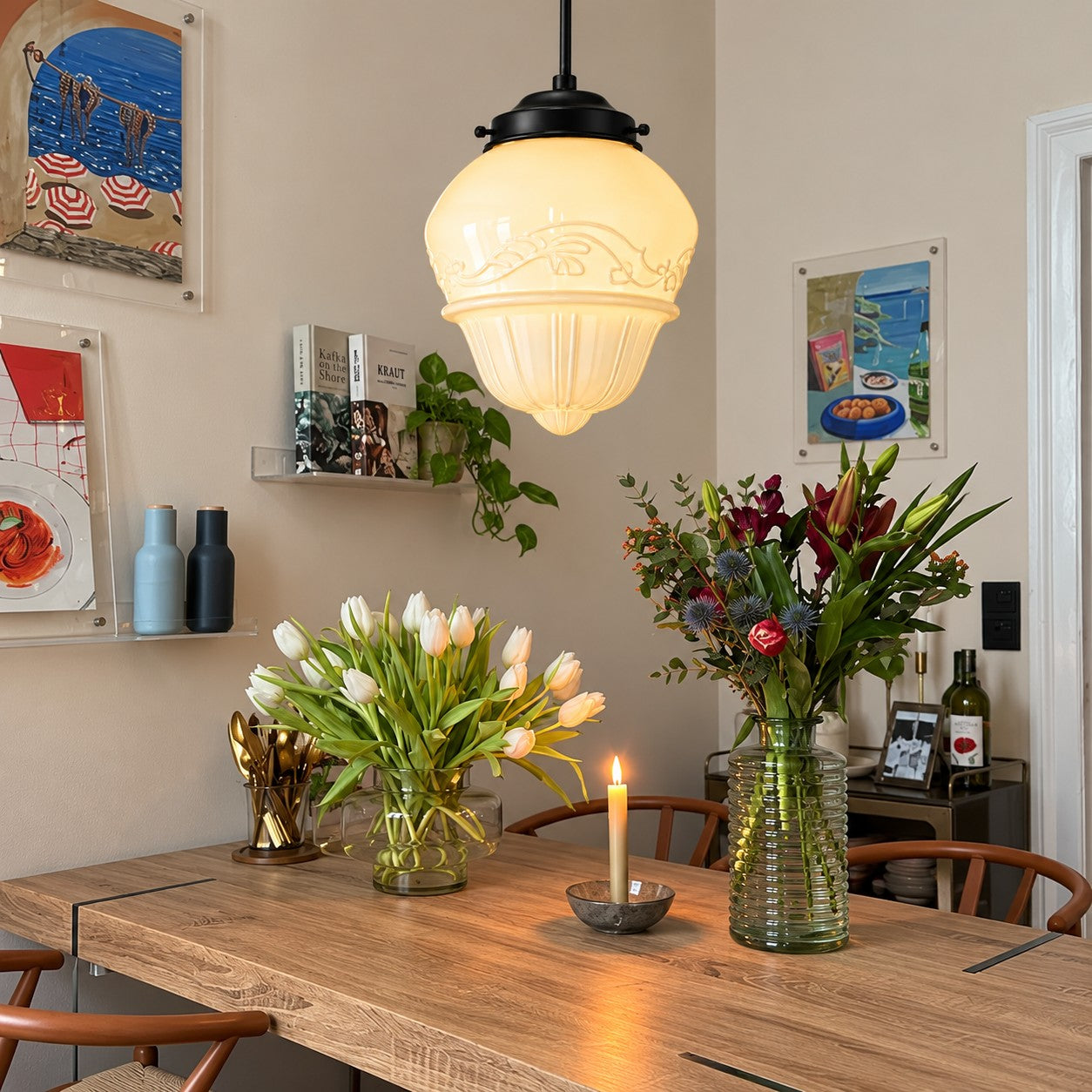 Opelina Model B milk glass pendant over a dining table