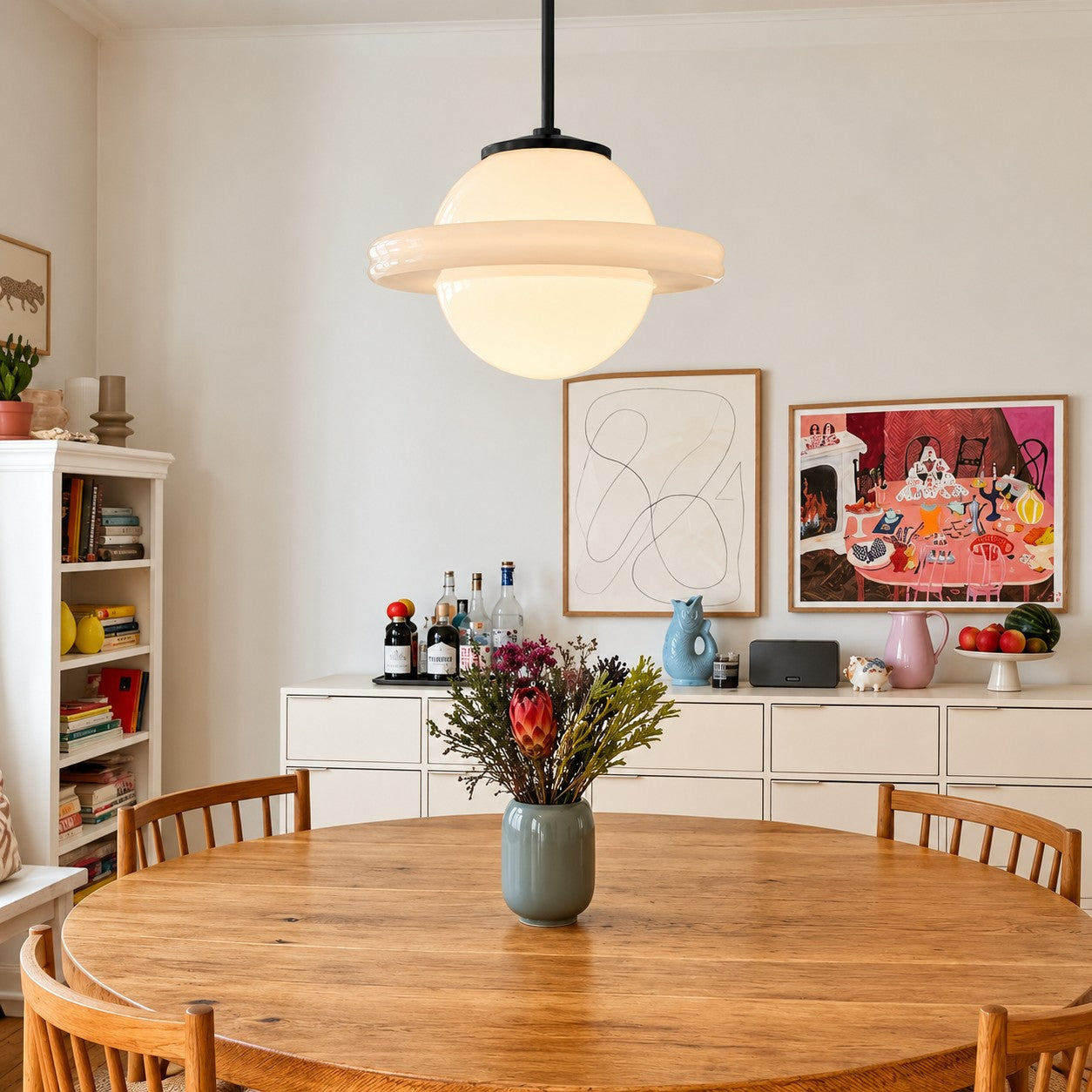 Opelina Model F milk glass pendant over a round dining table