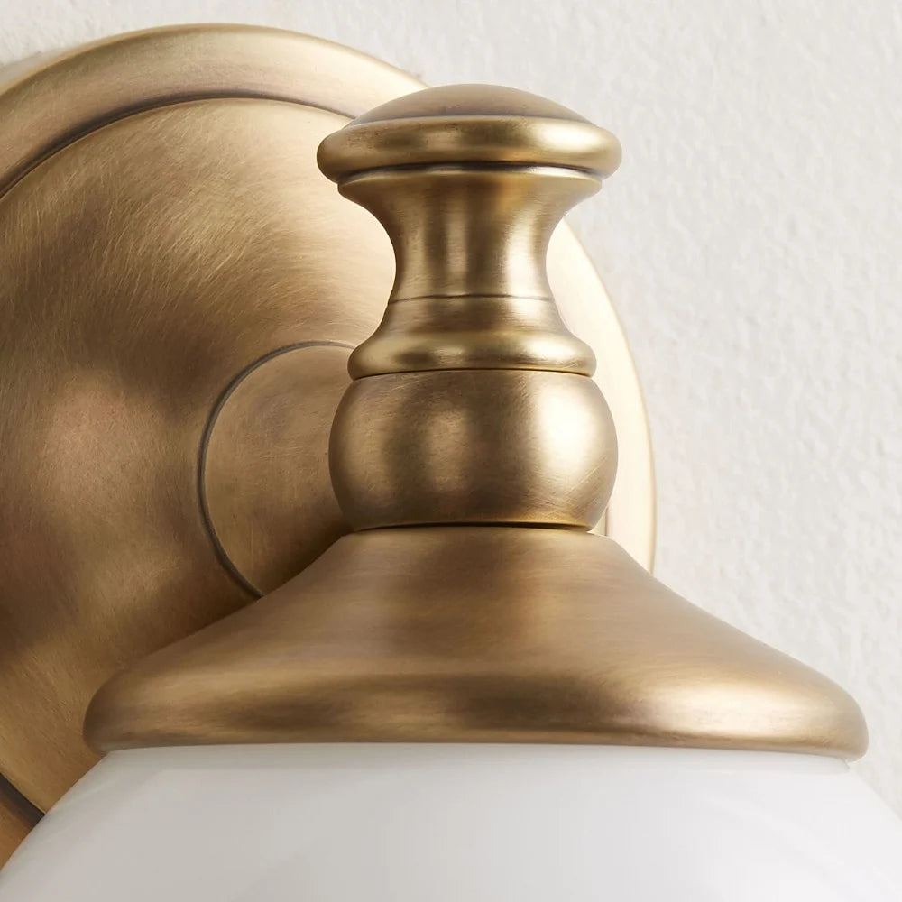 Opelina milk glass wall sconce brass cap close-up