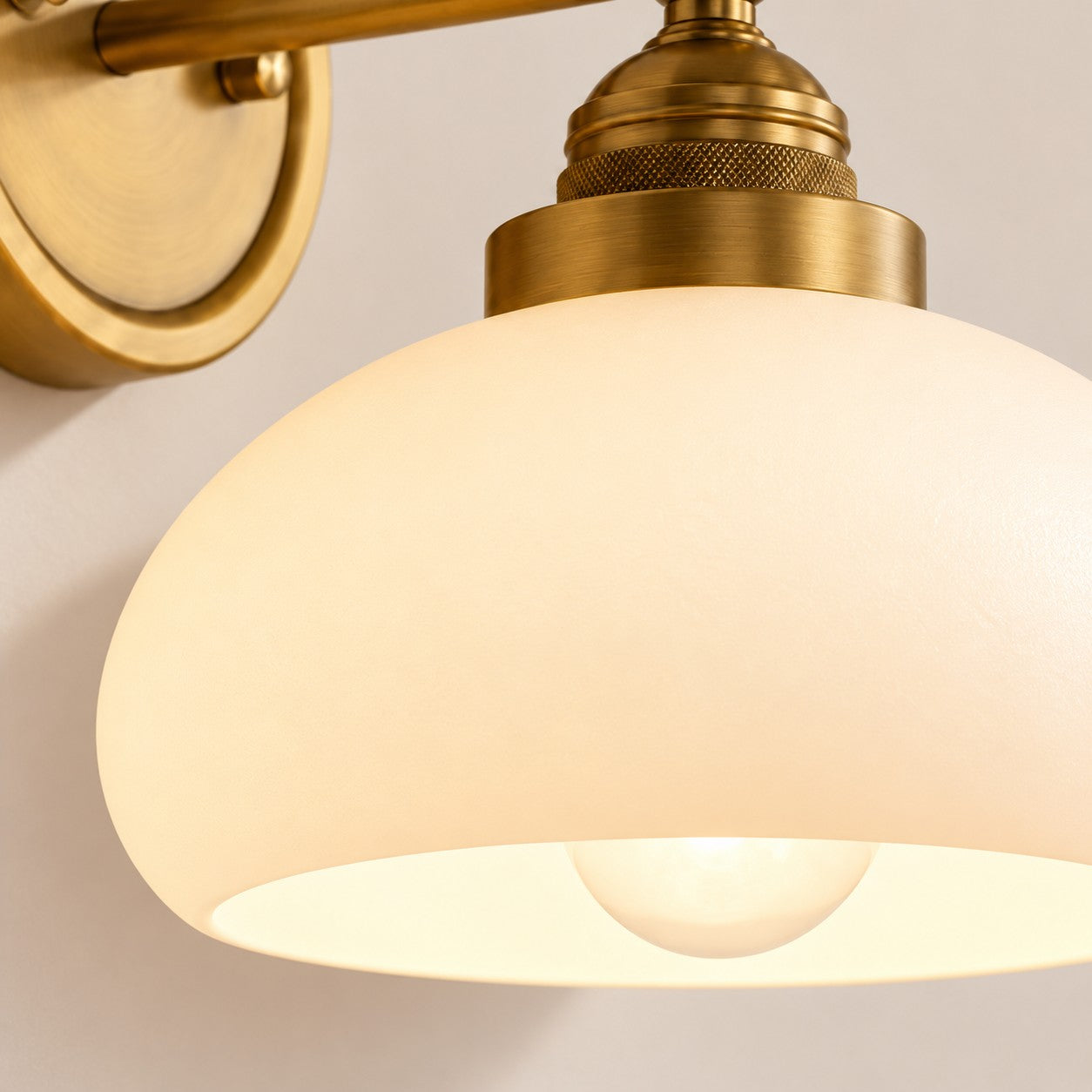 Opelina milk glass wall sconce side profile in brass