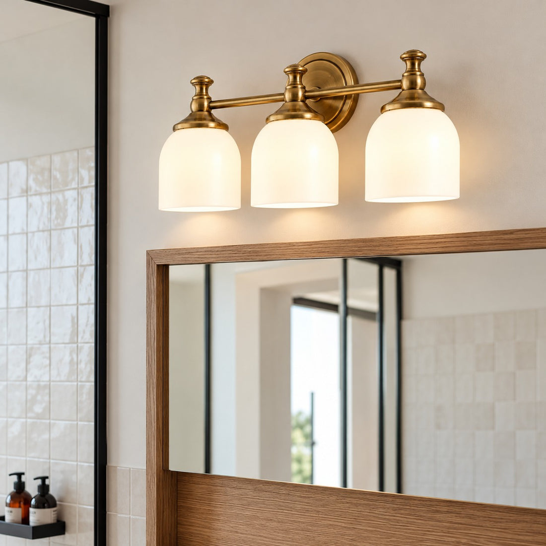 Opelina brass three-head milk glass wall sconce in a bathroom