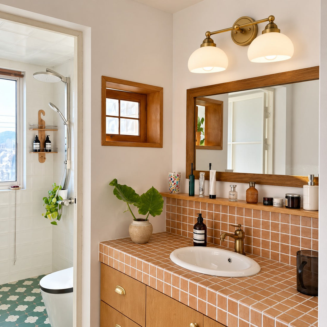 Opelina brass two-head milk glass wall sconce styled in a bathroom