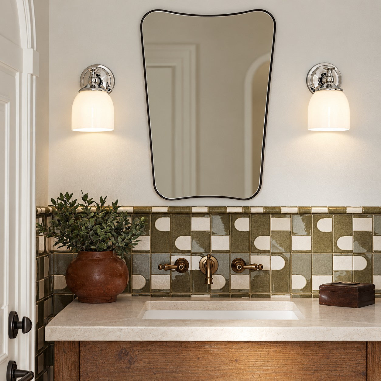 Opelina chrome milk glass wall sconce pair beside a bathroom mirror
