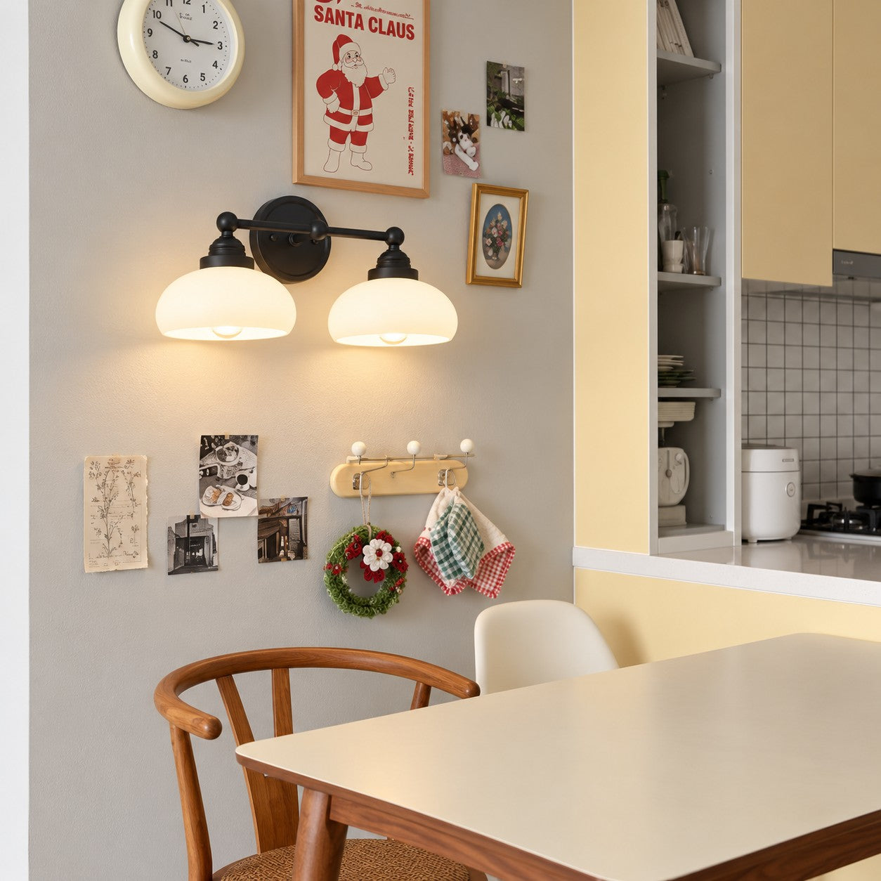 Opelina black two-head milk glass wall sconce styled in a dining room