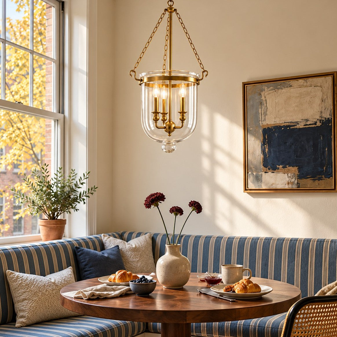 Vitrona clear glass bell jar pendant styled over a dining table