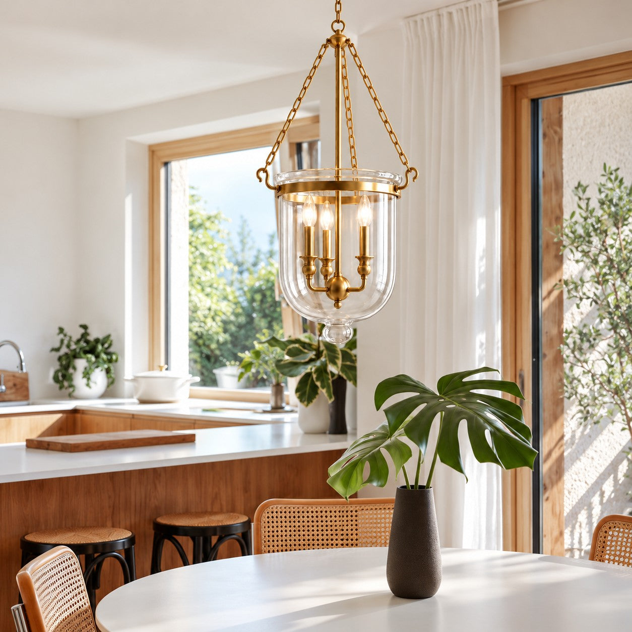 Vitrona clear glass bell jar pendant styled over a kitchen breakfast table