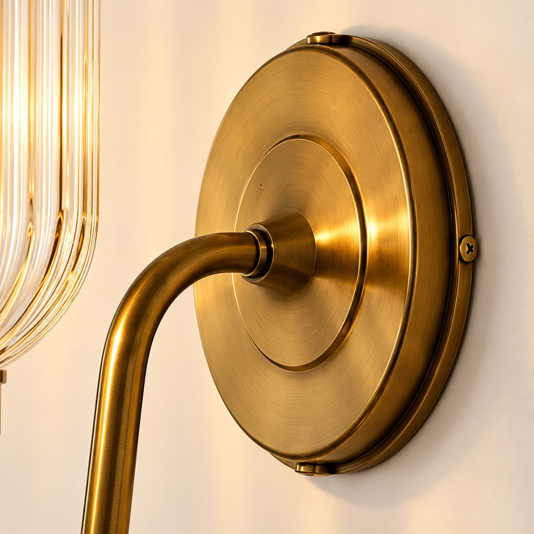 Vitrona ribbed glass wall sconce brass canopy close-up