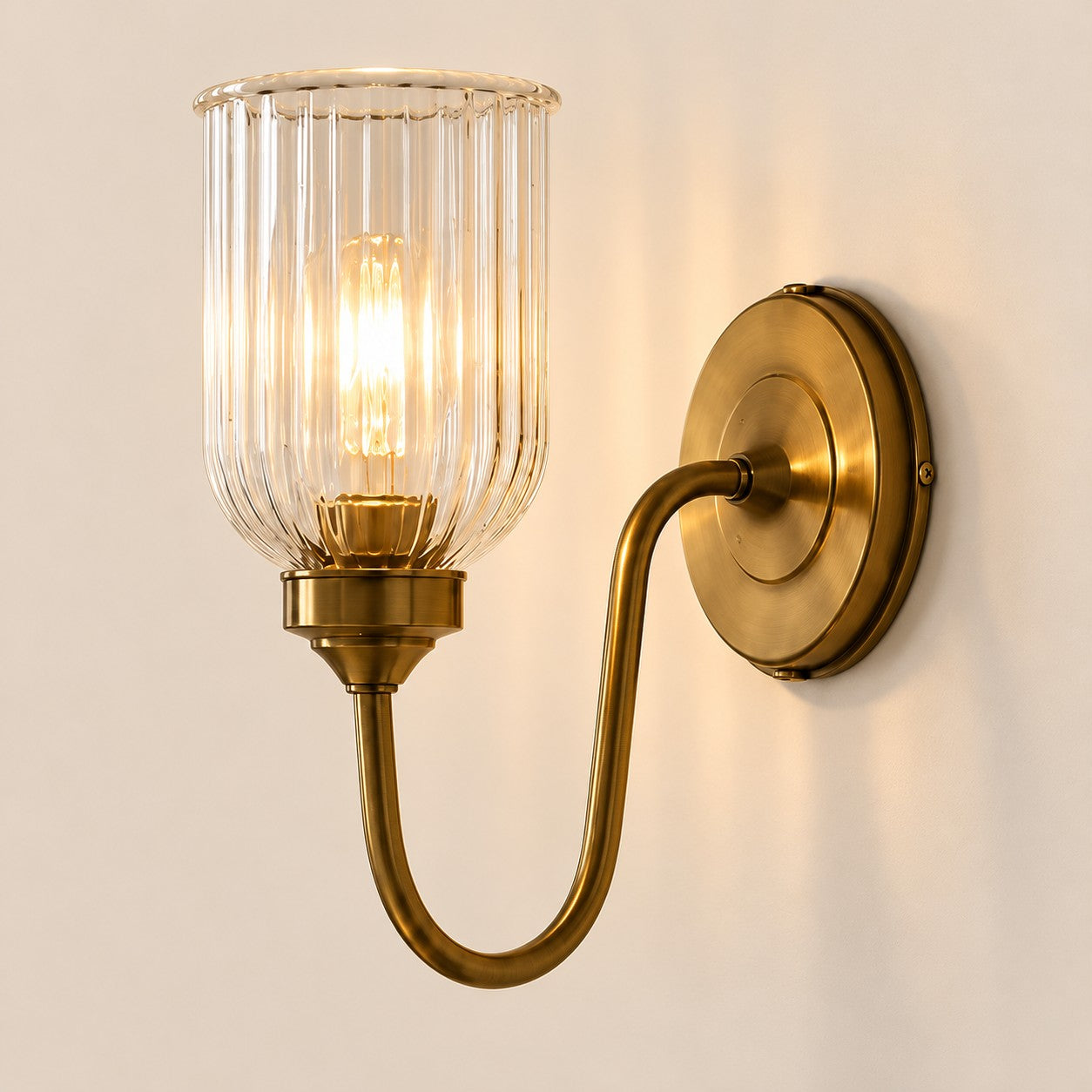 Vitrona ribbed glass wall sconce in antique brass
