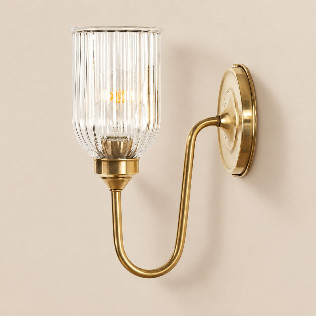 Vitrona ribbed glass wall sconce in burnished brass